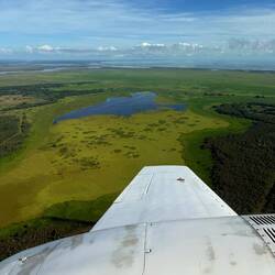 Giant lake, much of the green is moss on top of water