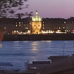 From across the river, Porte Cailhau, a historic city gate