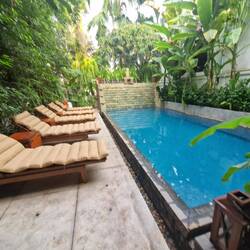 The shaded ground floor pool with waterfall