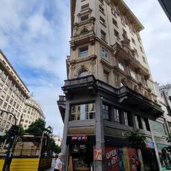 Interesting building. The little shop on the ground floor is one of hundreds all over the city.
