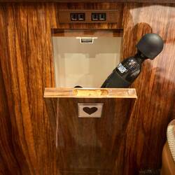 A, um, massage wand with its own convenient little pull-open compartment next to the bed. Labeled 🖤.