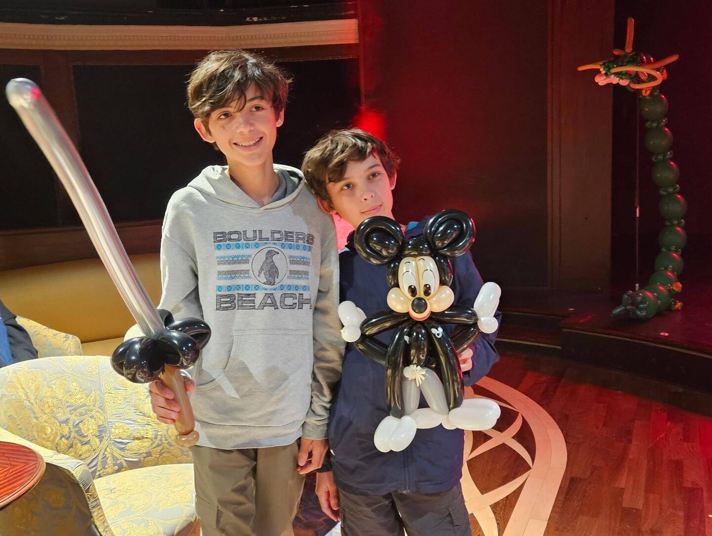 The boys with their gifts from the balloon artist.