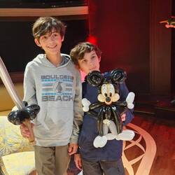 The boys with their gifts from the balloon artist.