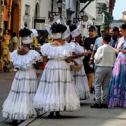 There's a wedding coming up... The ladies in white dresses are part of the ceremony.