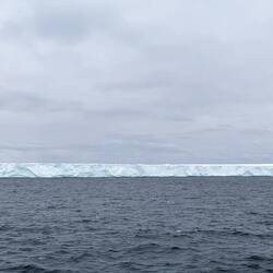 Panorama of icebergs near Ortelius as we head to the cabin to bundle up for the BBQ dinner.