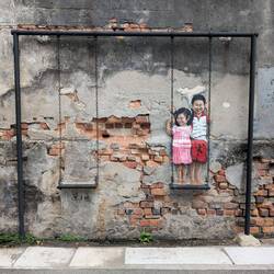 Street Art - Brother & Sister on a Swing