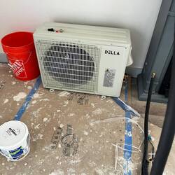 Mini split component that goes outside the house.