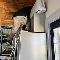 Brice installing the interior mini-split component.