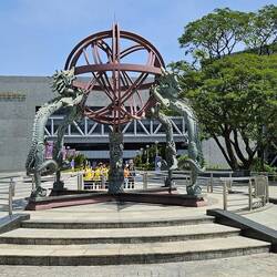 The exterior of the science museum with a group of school kids waiting to go in.