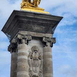 Pont Alexandre II bridge features four large gold-gilded statues of Pegasus