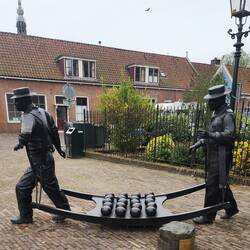 Statue of cheese carriers in town of Edam