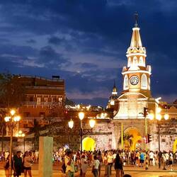 Puerta del Reloj in the colors of a sunset.