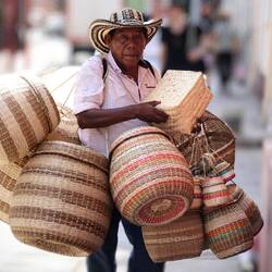 Basket seller with typical Colombian hat.