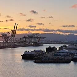 Sunset over Honolulu harbor from our boat.