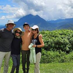The crew with "Child of Kinabalu" peak in the background.