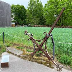 A bent cross from the spire of the old church, rescued and hidden by demolition workers