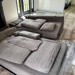 Sofa comes out of the package rolled up and compressed.