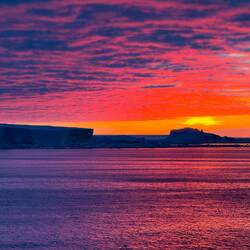 The sunset colors change as the sun gets lower on the horizon — Weddell Sea, Antarctica.