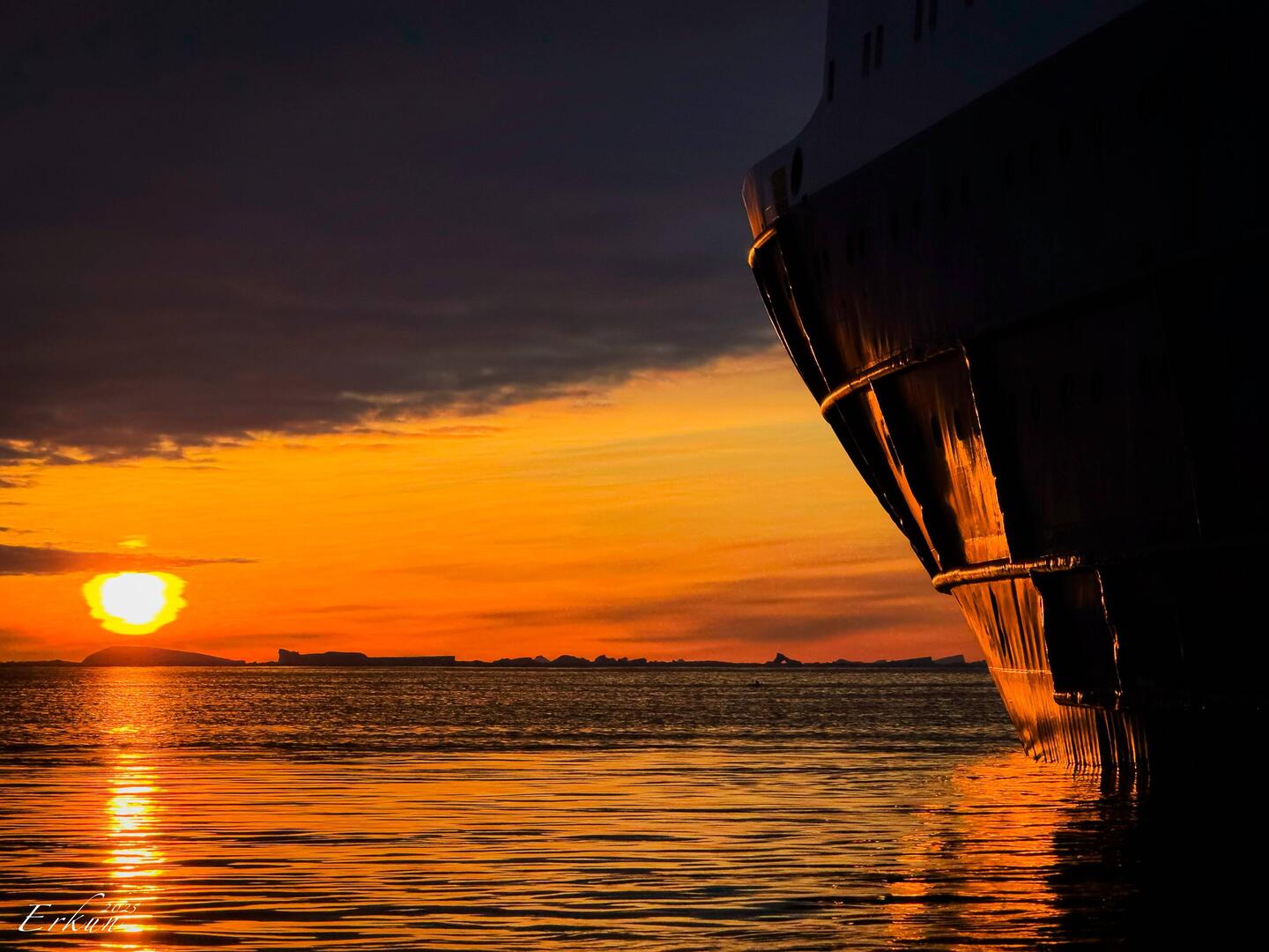Sunset as our zodiac approaches Ortelius — Weddell Sea, Antarctica.