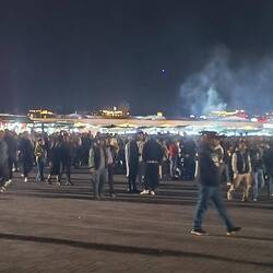 Main square packed with merry-goers at night