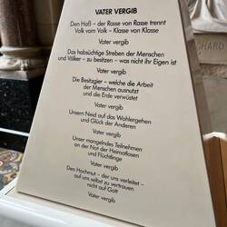 On the plinth of the Cross of Nails is Coventry litany of reconciliation in German