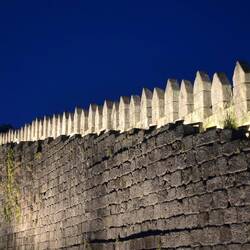 Old walls of the city at night