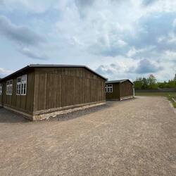 Recreated huts, using original materials from other camps