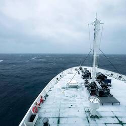 An overcast day with snow on deck as Ortelius continues south in the Weddell Sea.