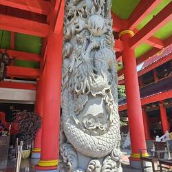 Ornate column in the front of one of the temple buildings.