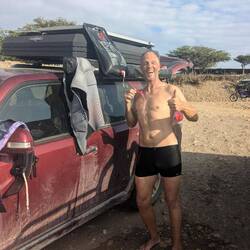 Using our solar shower. Once you get off the water it is really nice to get a warm/hot shower