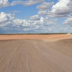 The road crossed what looks like a dry lake