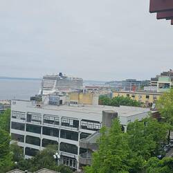 Our cruise ship is to the right of the more clearly visible ship there WAY in the distance