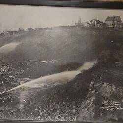 Picture of water cannons clearing the mountain to make way for the rebuilding of Seattle.