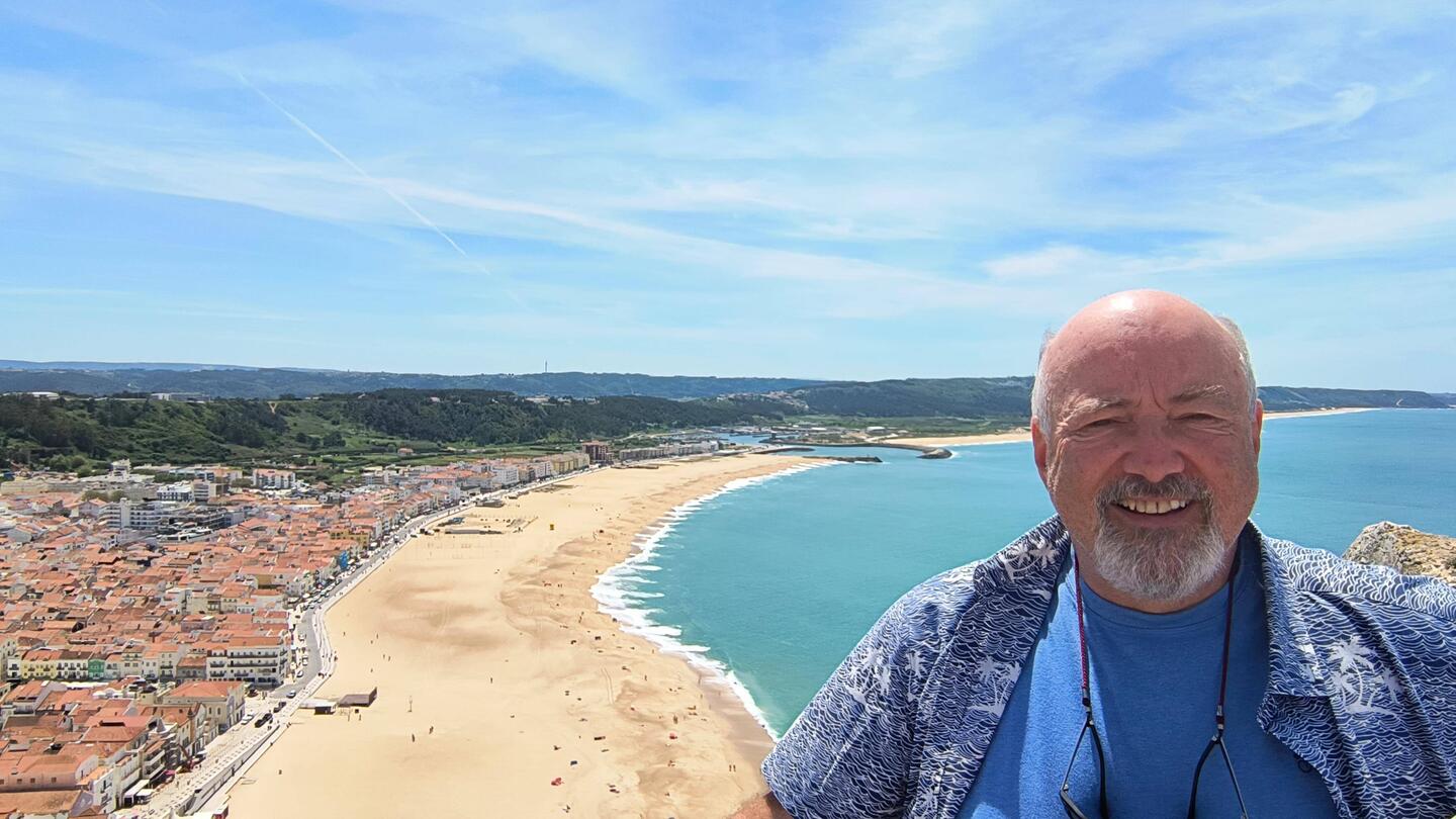 Spectacular view of ocean, beach, and town.