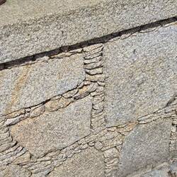 Look how they layer stone between the large rocks in this wall