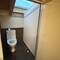 Yep, that's a beam about 4 feet off the floor, right over the toilet. Do not get up fast!