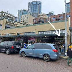 The beginning & store entrance wait line for coffee in the city that created the pricey cup.