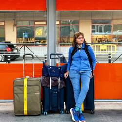 We are waiting for the airport shuttle after 36 hours of non-stop travel - she is over it!