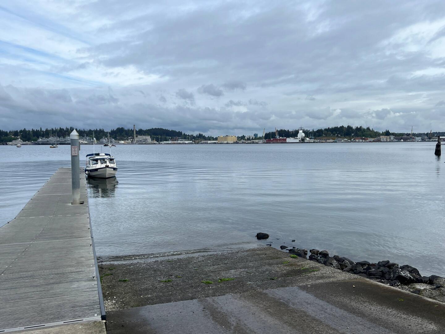 Port Orchard boat ramp.  Military war ships across the water.