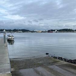 Port Orchard boat ramp.  Military war ships across the water.