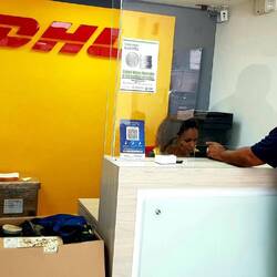 DHL office: a 23 kg box (the one on the scale) has been "repatriated".