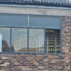 View from Rainboat of the ceramics drying inside the factory