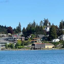 View of Poulsbo waterfront with First Lutheran Church steeple and roof rather prominent.