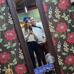 Mirror selfie in a thrift store (called charity shop in England)