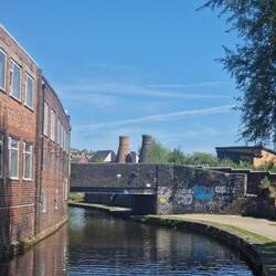 Leaving Stoke-on-Trent; a characteristic scene of a brick factory and bottle kilns.