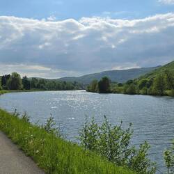 The river and surrounding hills are beautiful