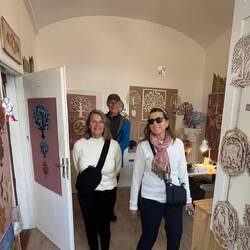 A local artisan who carves and paints the wood trees