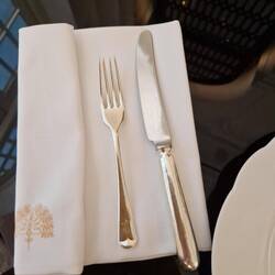 Quality cutlery and starched monogram serviettes