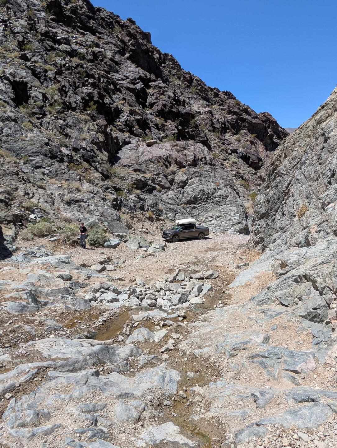 We finally got stuck down there. We needed to drive up this rocky ridge to where I was standing..