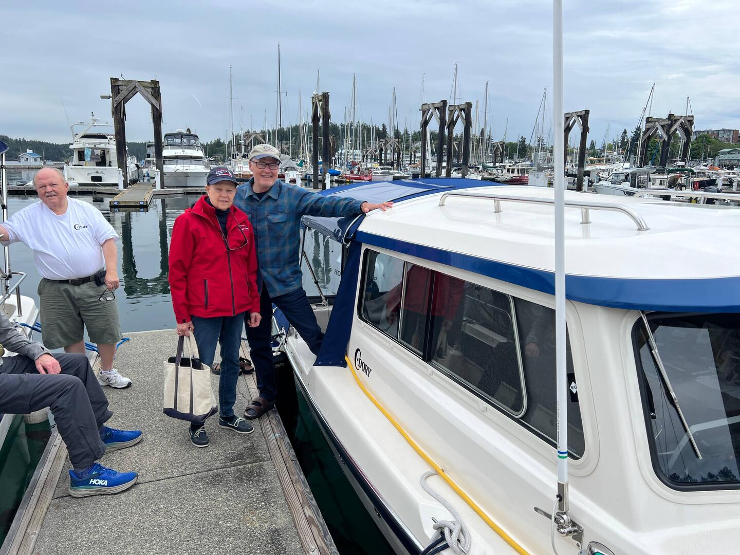 One of the USCG Auxiliary members doing our safety inspections, with Brock from Songbird
